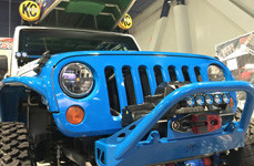 KC HiLiTES FLEX LEDs on the Front of Blue Jeep 